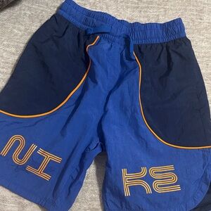 Nike Blue and Black Athletic Shorts with Orange Accents